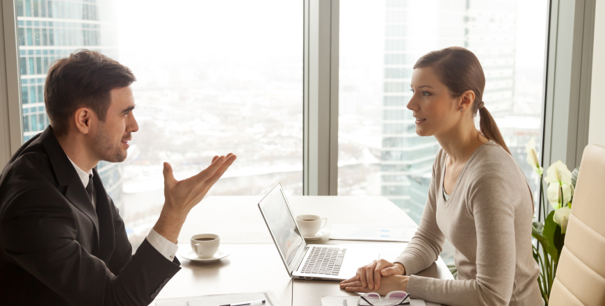 businessman-businesswoman-discussing-work-office-desk (1)